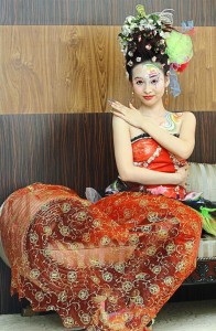 Model Goh Shia Ling wearing of a hairdo to match a dress from designer Zi Wen Chuah during an event to announce the International Beauty Expo in May